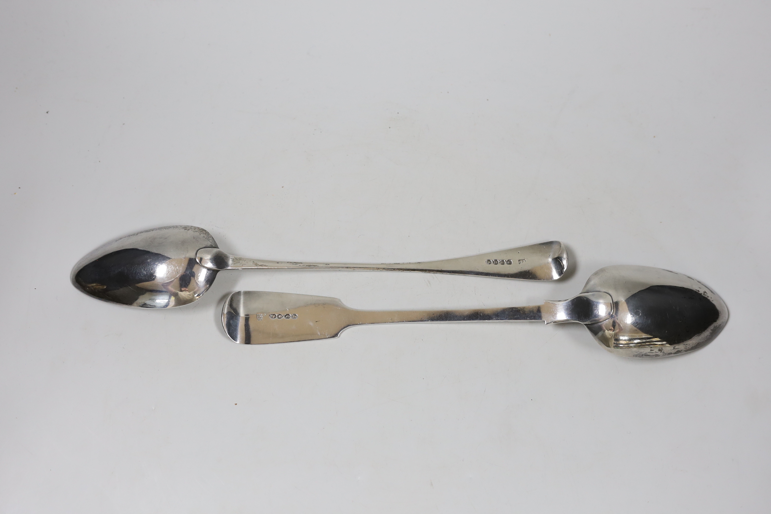 A George III Old English pattern basting spoon, London, 1811, 29.4cm and a later silver fiddle pattern basting spoon, London, 1859, 7.8oz.